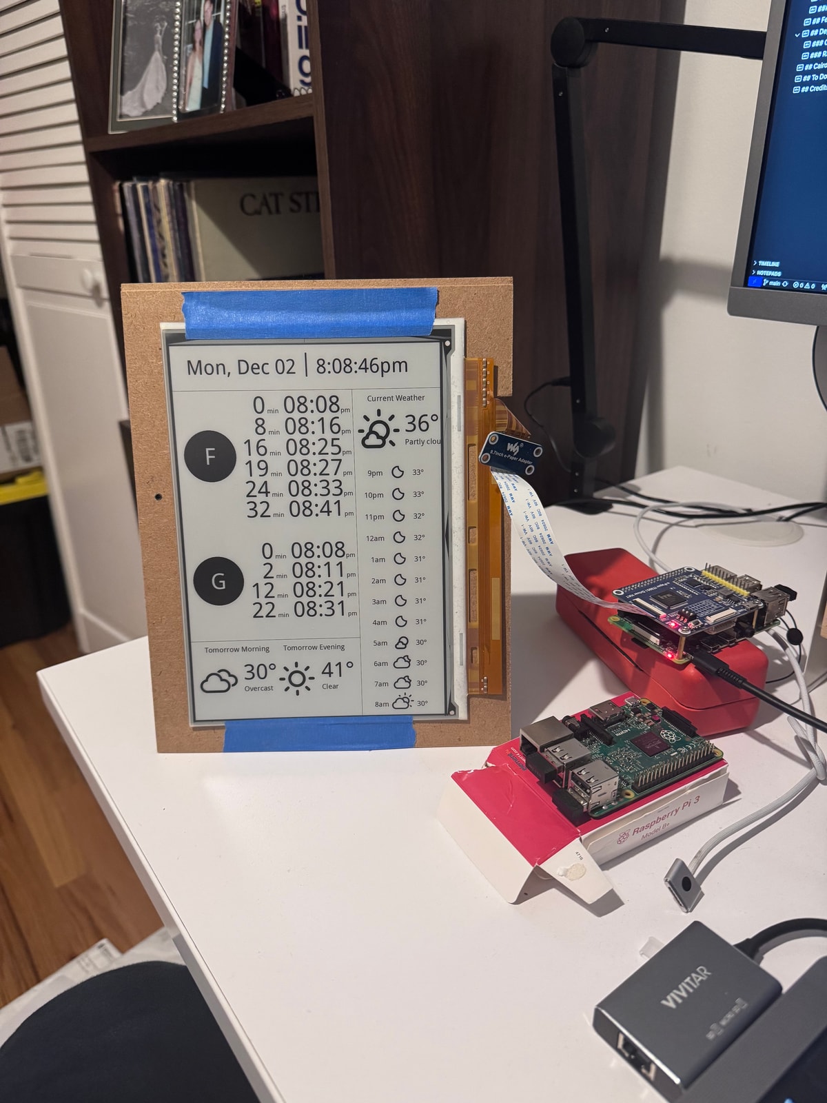 Raw e-ink display showing the train tracking interface